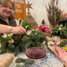 Load image into Gallery viewer, a very happy woman making a christmas wreath at very popular and sought after wreath workshop with bits and buds florist in leighton buzzard Girls night in bedfordshire