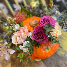 Load image into Gallery viewer, floral pumpkin in an orange halloween pumpkin to make a spooky season decoration at a flower workshop at bits and buds florist leighton buzzard