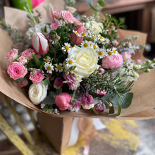 Load image into Gallery viewer, gift Bouquet of spring flowers and roses wrapped in brown paper on a table from bits and buds florist in leighton buzzard not interflora british flowers