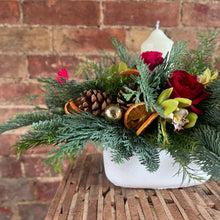 Load image into Gallery viewer, close up detail of concrete pot and Christmas decorations in festive Candle arrangement from Bits and Buds florist Leighton Buzzard
