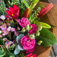 Load image into Gallery viewer, detailed close up of flowers in a pink ad red valentine's bouquet with lilys and freesias
