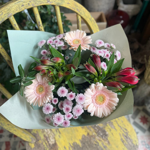 bunch of arranged flowers that are cheap and cheerful with gerbera daisies making them affordable and pretty for birthdays and thinking of you gifts from bits and buds florist in leighton buzzard available for delivery and collection