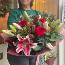 Load image into Gallery viewer, Person holding a large bouquet of flowers for Christmas in Bedfordshire
