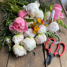 Load image into Gallery viewer, Bouquet of flowers with scissors on a wooden surface with a tropic lipstick for a flower workshop in leighton buzzard at Bits and Buds florist
