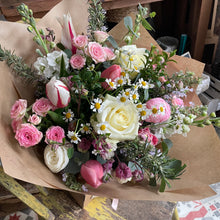 Load image into Gallery viewer, Bouquet of flowers with pink, white, and green colors on a rustic wooden surface featuring spring tulips and roses from bits and buds florist in leighton buzzard bedfordshire
