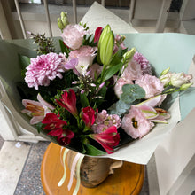 Load image into Gallery viewer, Bouquet of flowers on a table outdoors at Bits and Buds florist Leighton Buzzard. With scented lily flowers available for delivery and online shopping 
