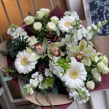 Load image into Gallery viewer, When doves cry Christmas bouquet from Bits and Buds florist leighton buzzard with white flowers and pine cones plus festive greenery
